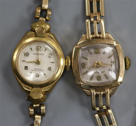 A ladys 9ct gold wristwatch with gatelink bracelet and cushion-shaped dial and another wristwatch.